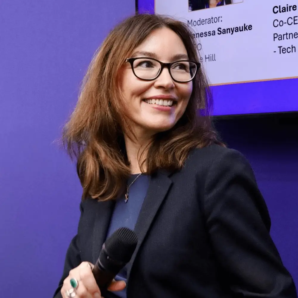 Elena Sinel, Founder and CEO of Teens in AI, speaking at a conference